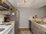 Fully equipped kitchen with microwave, coffee maker, and toaster 